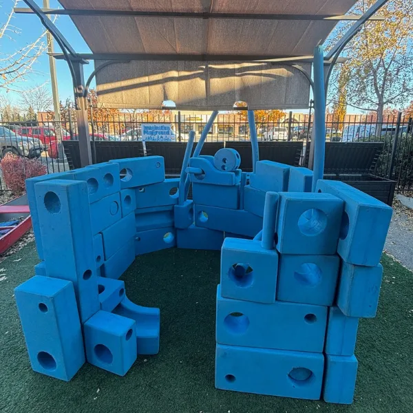 Giant blue blocks of different shapes and sizes in a fort-like structure