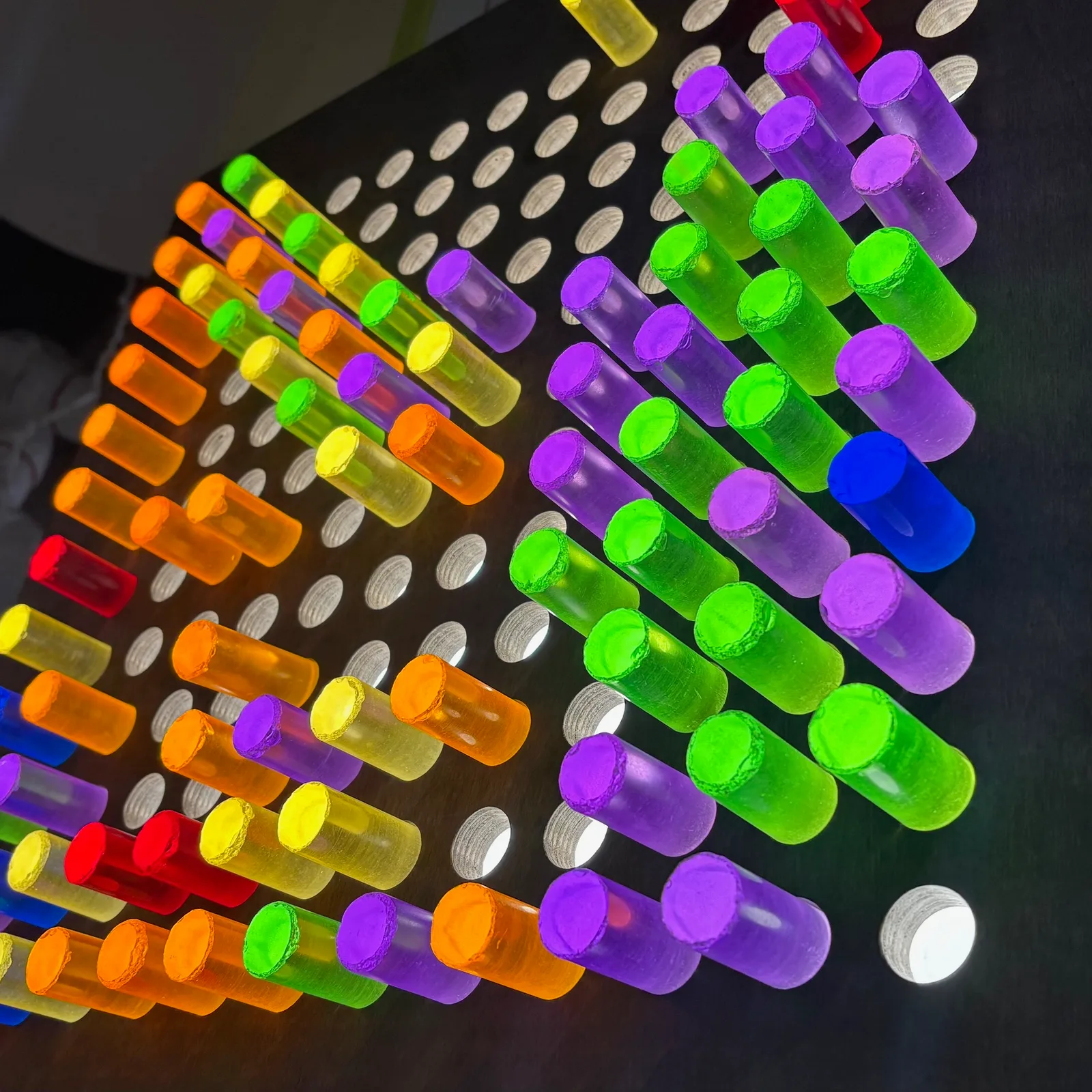 Giant illuminated peg board kids can put colored pegs into