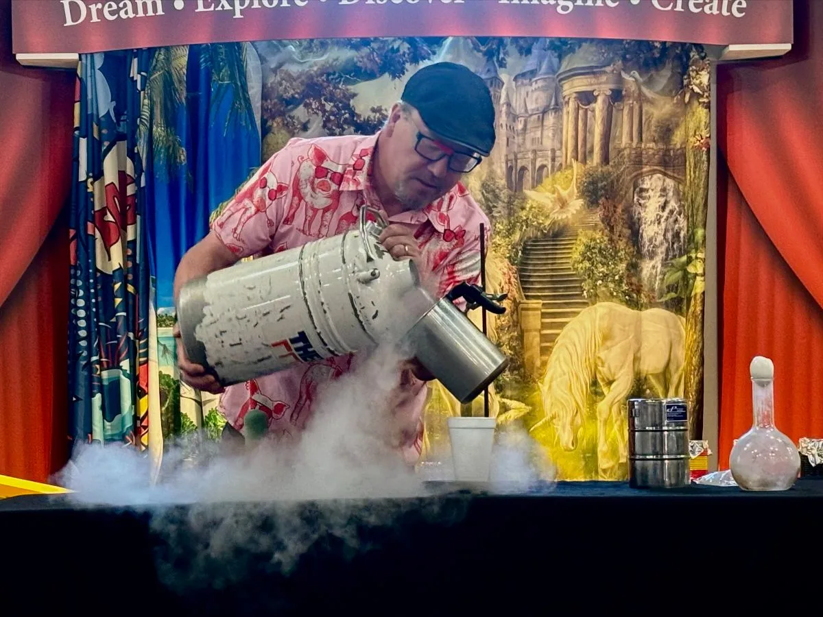 Dr. Picklestein demonstrating a liquid-nitrogen science experiment to a museum audience.