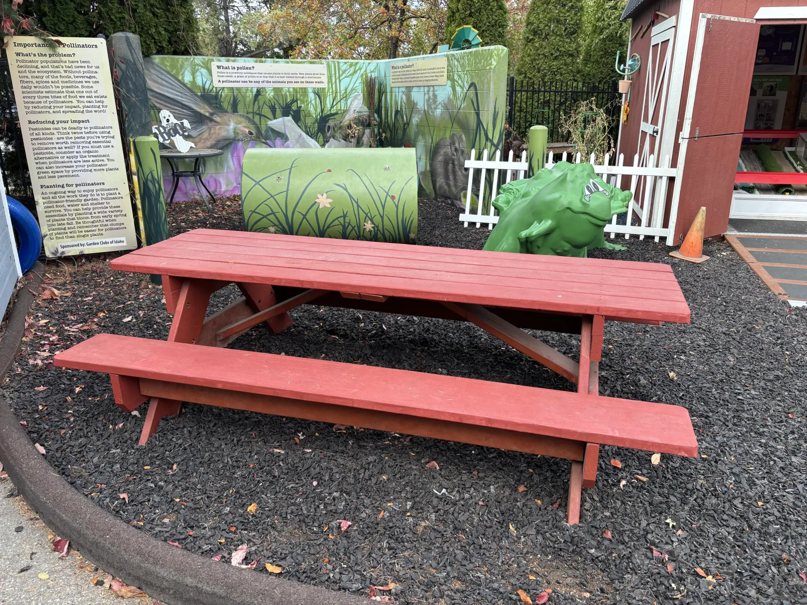 A red picnic table in the museum's outdoor area.