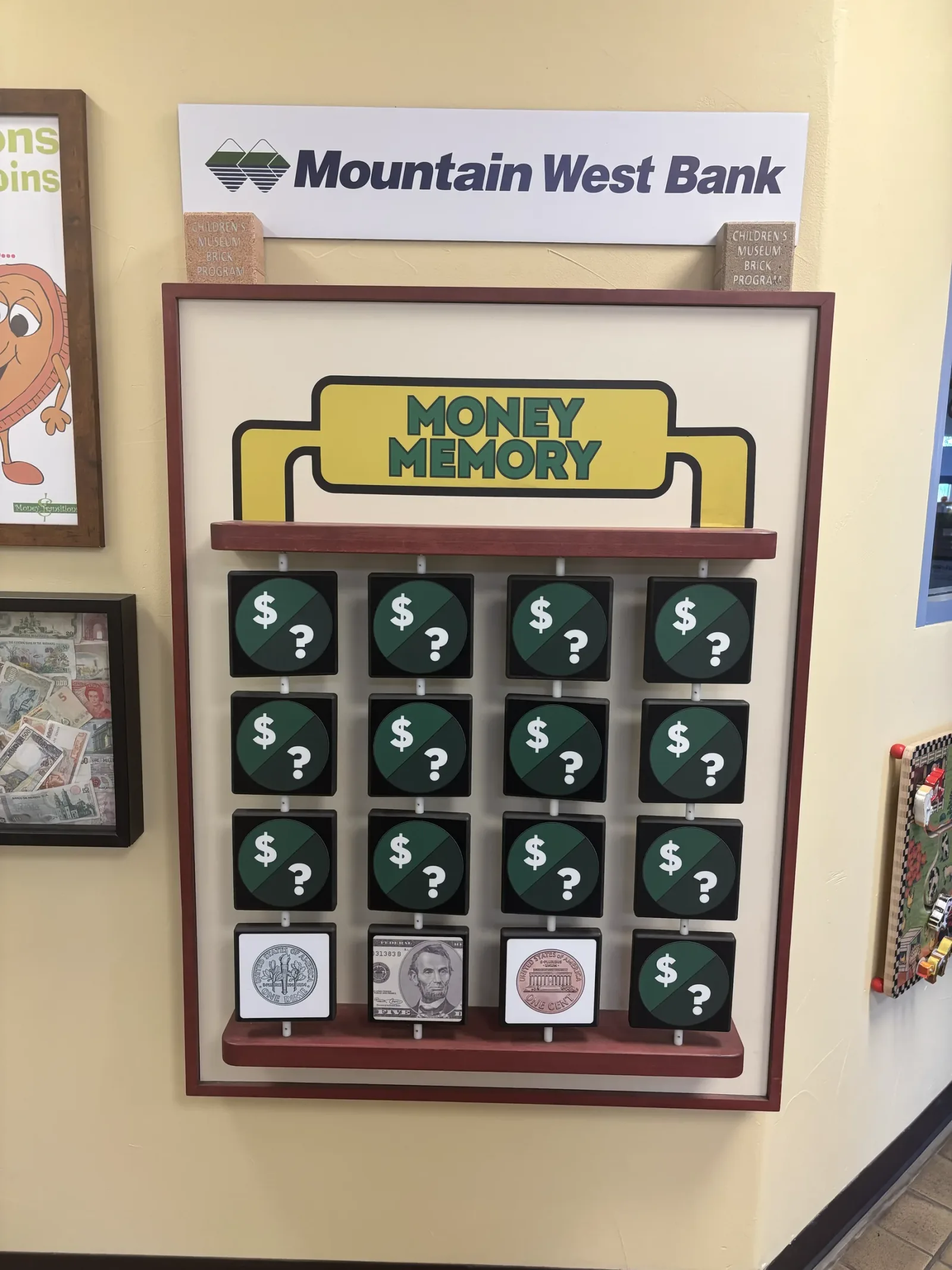 The Money Memory wall from Mountain West Bank: a grid of cards to flip, with coins and bills to match.